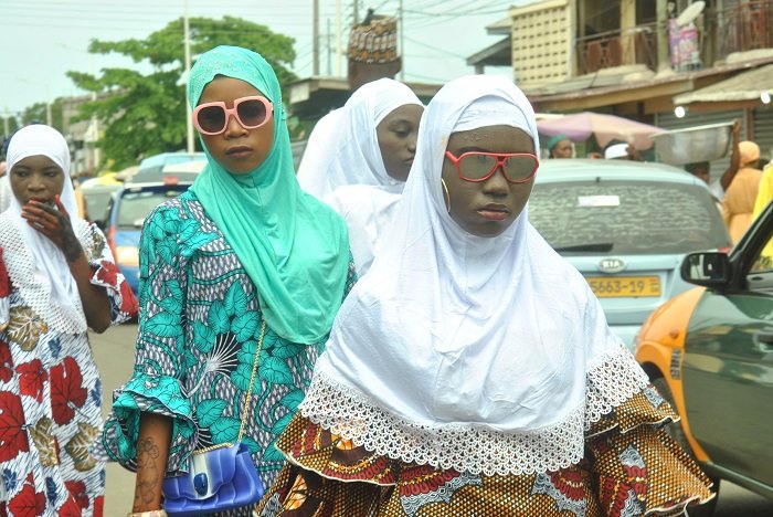 The young ladies clad in beautiful dresses