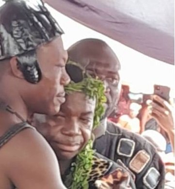 Nana Dadzie, right, being embraced by Nana Asokwa Kwegyir II after his installation