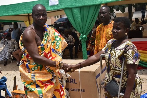 • Madam Hannah Nketsiah (right) receiving a deep freezer from Nana Atta Krakra I