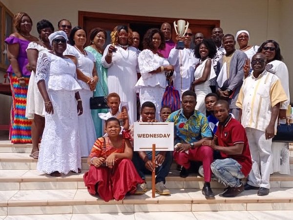 Wednesday group displaying their trophy