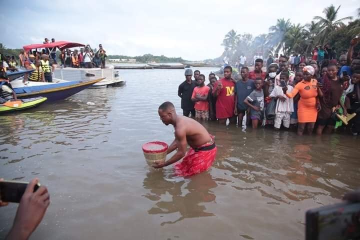 A man fetching water with basket