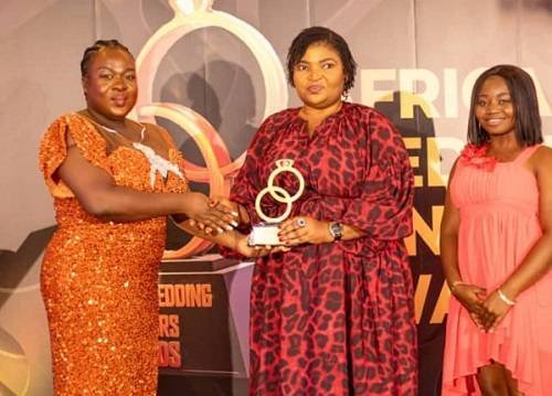 Bridget Mensah (middle) receiving the award from the organisers