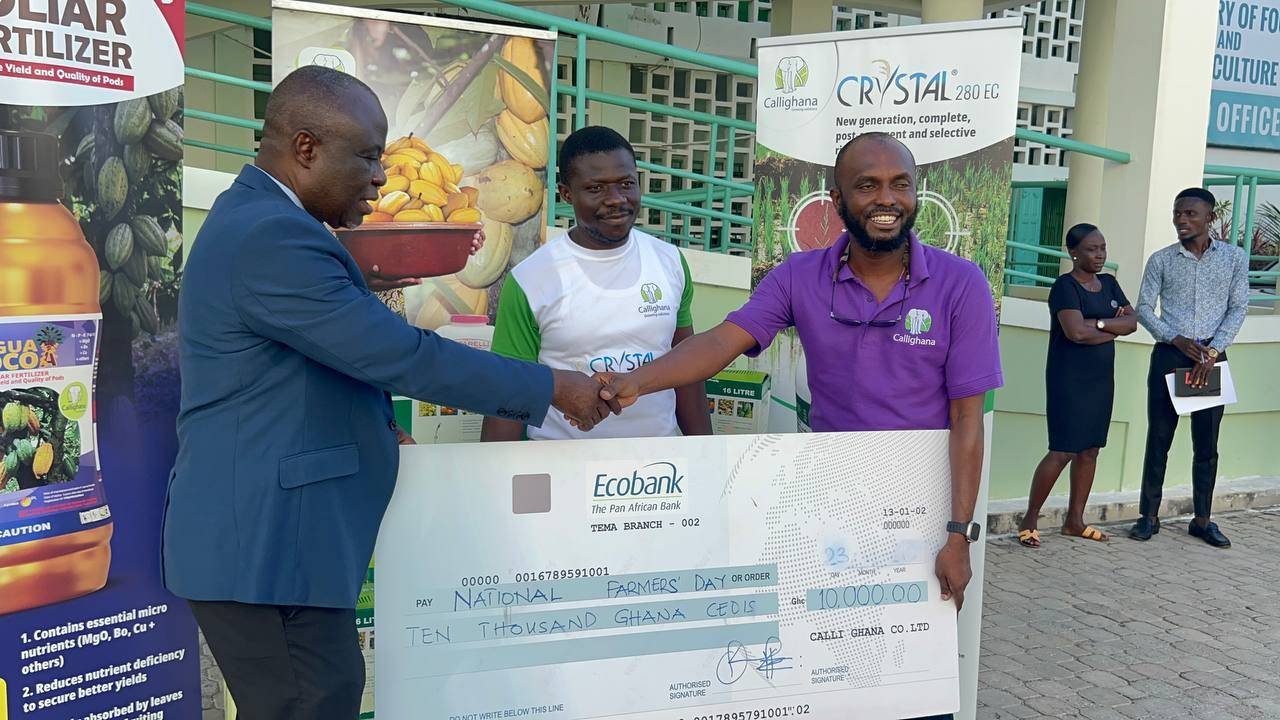 Mr Apratum (right) presenting the cheque to Mr Addo