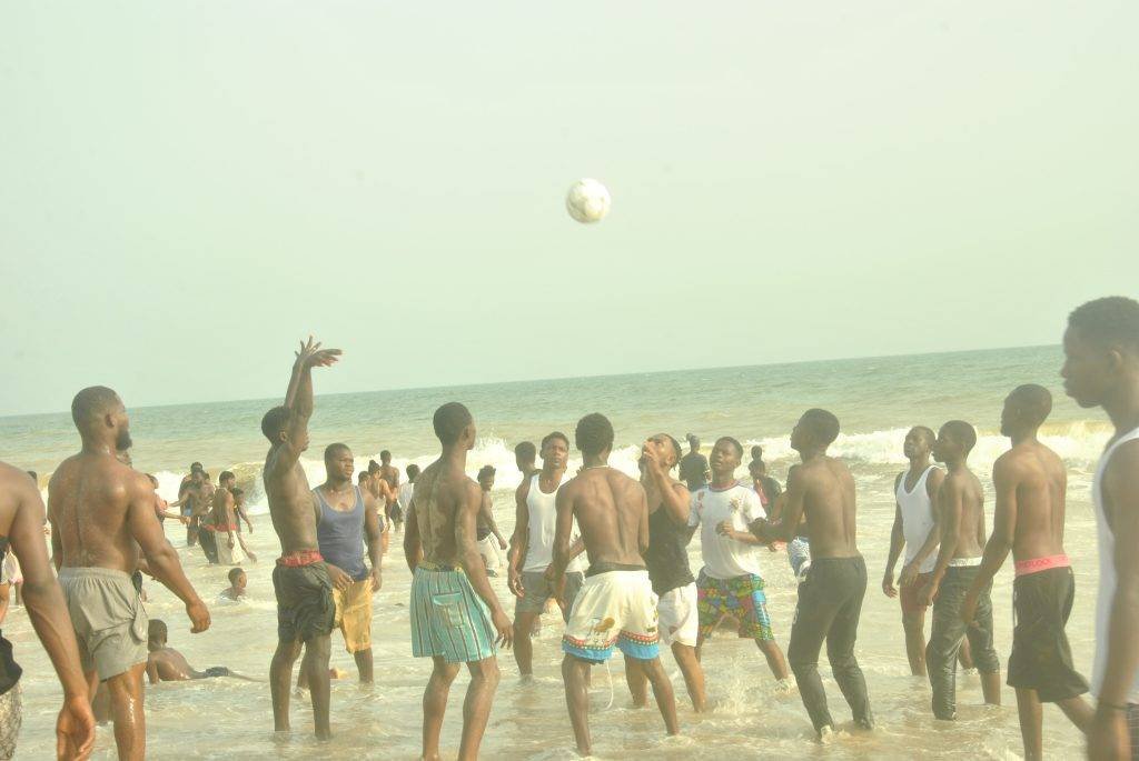 A section of revellers playing volleyball at the beach