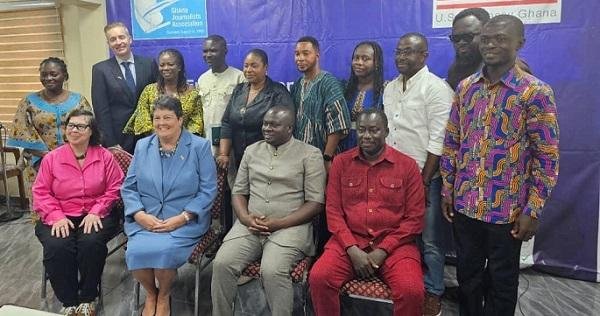 • Ms Virgina in group picture with dignitaries after the event