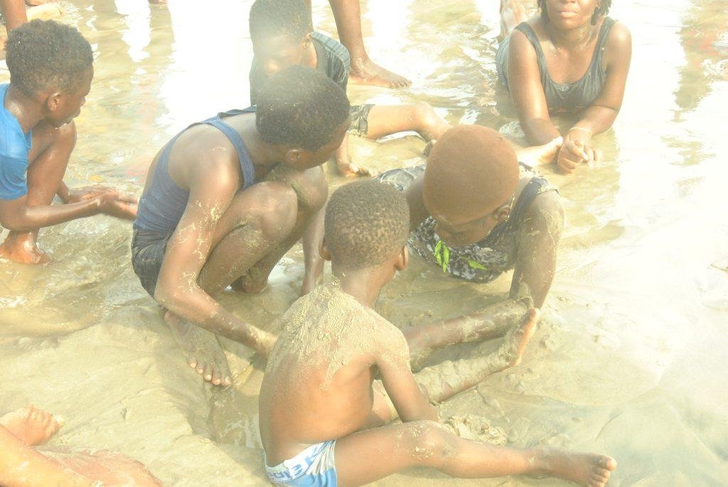 Some of the children playing in the sand