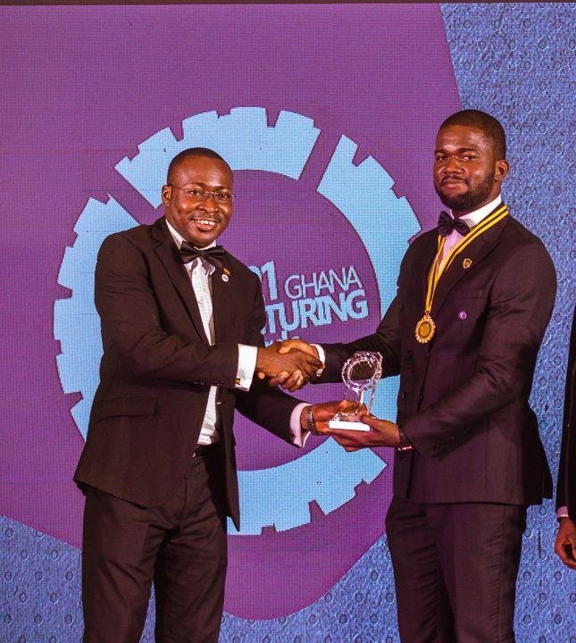 Mr Dzamefe(right) receiving an award