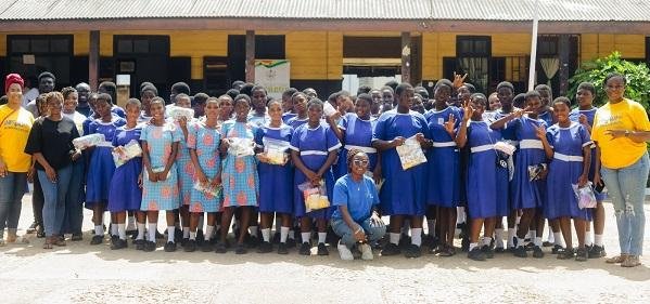 • Ms Nkrumah Abamfo(squatting) in a pose with some school girls and organisers