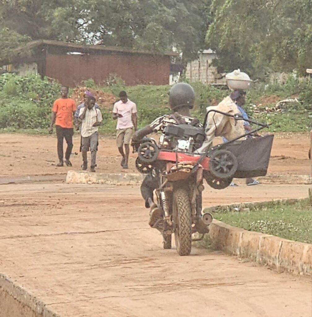 A motorcycle carrying a heavy item