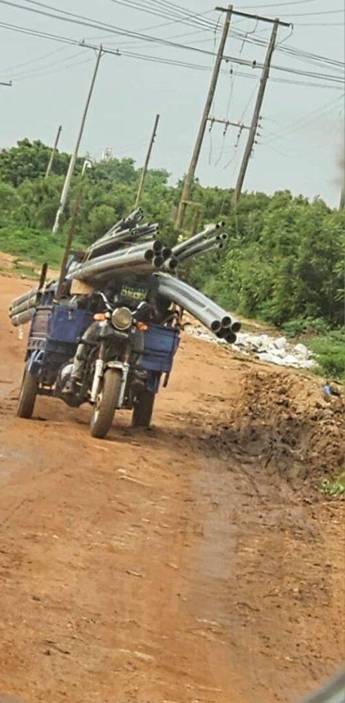 An overloaded tricycle with the potential to prevent the rider from seeing his way clearly