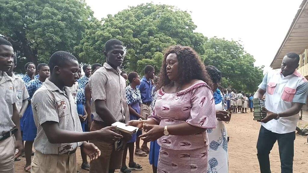 Ms Rita Naa Odoley Sowah (second from right)distributing mathematical set to BECE candidates writing the exam at the La Presby Centre at La in Accra. Photo. Victor A. Buxton