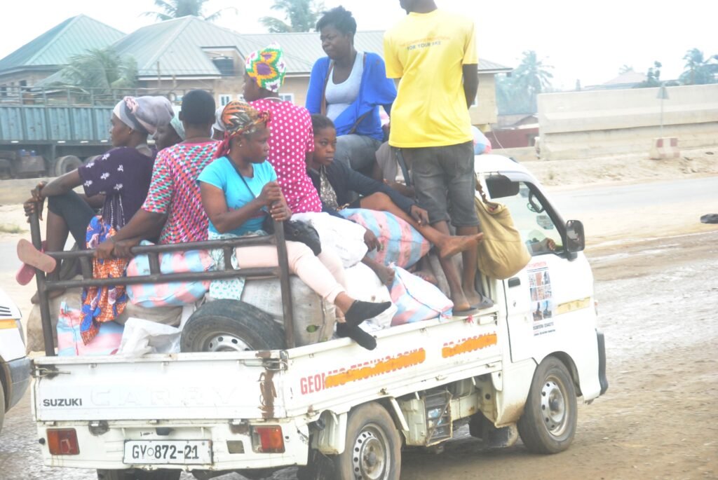 Our mothers seating on top of their foodstuffs in a moving vehicle on the Nsawam road