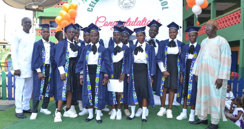 • Mr Amago (left) with Mr Siedu (right) and the graduands Photo: Victor A. Buxton.