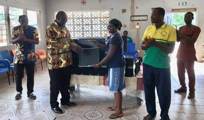 • Dr Acheampong (left) presenting the items to Good Shepherd Home