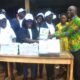 Prof. Alice Mensah presenting the books to Mr Bright Loggah the headteacher of Mpehnasem Methodis Basic school with the staff of ATU and pupils Photo: Lizzy Okai