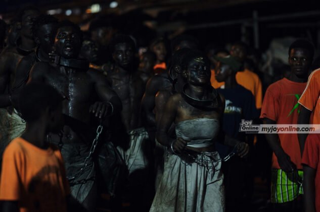 A group re-enact the days of the slave trade