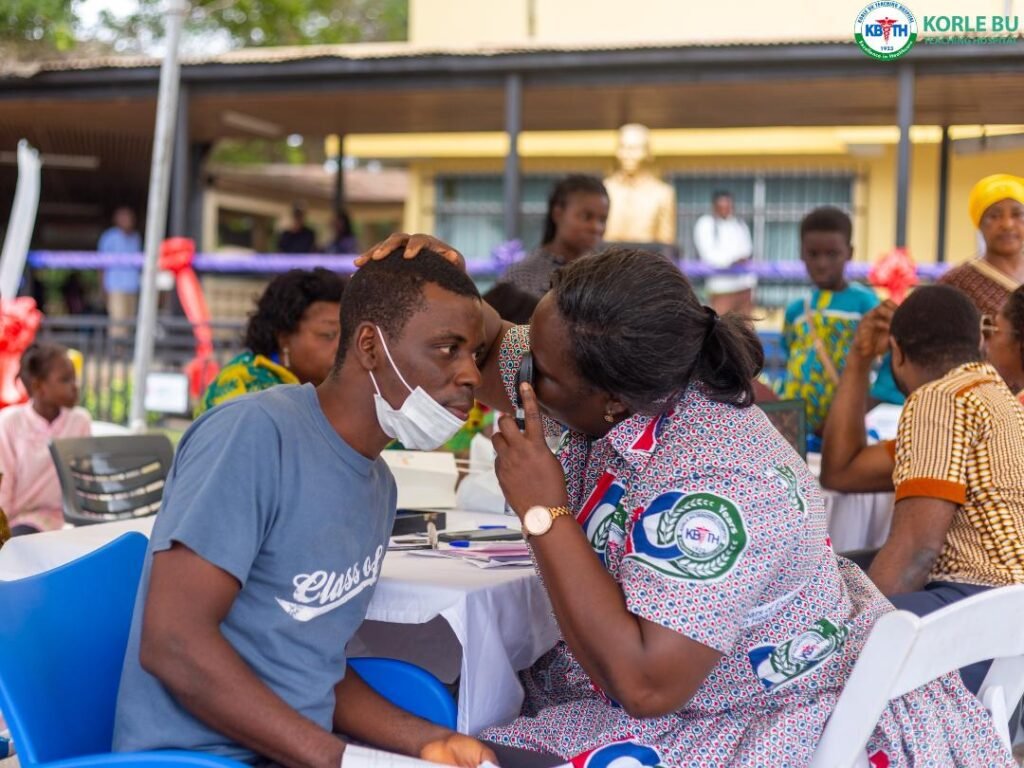 A staff of Korle-Bu screening a patient