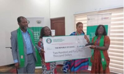 Madam Fattoh (right)presenting the cheque to Dr Awinubonu (right)