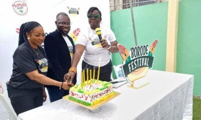 • Mr Felix Afutu (middle) cuts a cake with Opoku-Agyemang (right) and Adomako-Mensah (left) to officially launch the festival