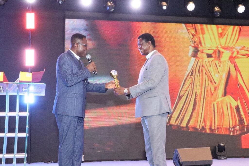 • Apostle Dr Amoani ( right), receiving an award