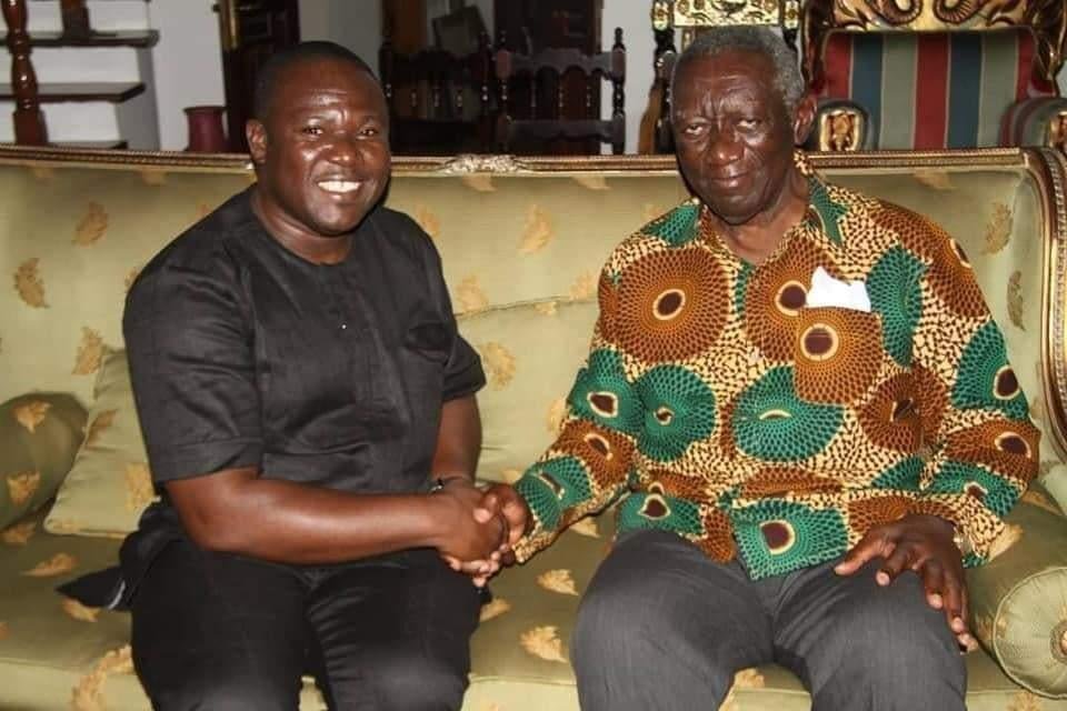 Mr Antwi in handshake with former president kuffour