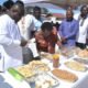 • Mr Nikoi (left) and other dignitaries inspecting some of the products from the graduands Photo Victor A. Buxton