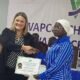 Mrs Burkett (left) presenting an award certificate to Muhammed Bin Aisha, a BSc Petroleum Refining and Petrochemical Engineering student at University of Mines and Technology (UMaT),Tarkwa.