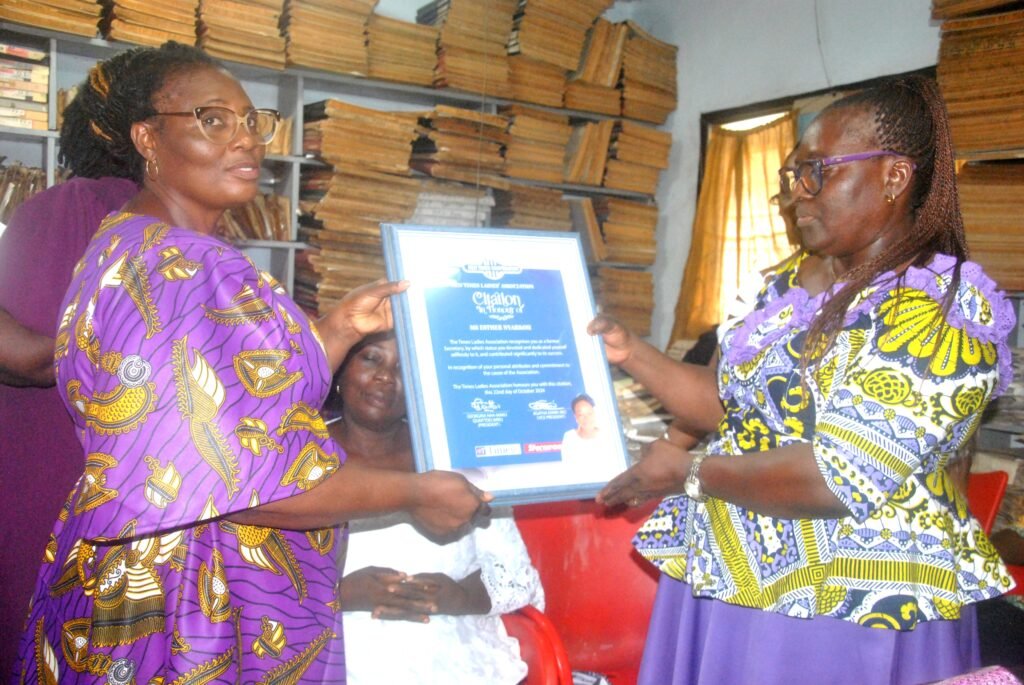 Mrs Esther Ofori Addo receiving a citation onbehalf of  Mrs Esther Nyarko.from Mrs Quaittoo.
