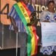 Mr. Daniel Titus-Glover (left), Greater Accra Regional Minister presenting to Mr. Stephen Addo, the National Best Physically Chanllenged Farmer Award