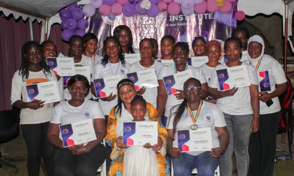 •Mrs Ofori (seated, middle) with participants displaying their certificates. In front of her is El-Zoe Van-Dyck, a sixyear- old who also aquired the skills