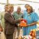 • Ms Rosemary Beryl Archer (right) presenting a made in-Ghana product to Mr Yaw Frimpong Addo