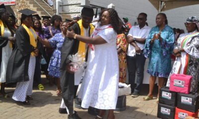 Ms. Sowah (right) congratulating one of the beneficiaries Photos Victor A. Buxton