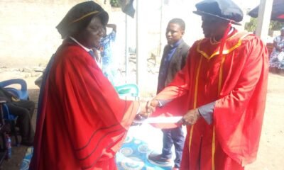 • Bishop Dr Fredrick Adjei presenting a certificate to Prophet Dr Mawuli Akorli.Looking on is Prophet Dr Joshua Abass Osumanu