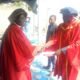 • Bishop Dr Fredrick Adjei presenting a certificate to Prophet Dr Mawuli Akorli.Looking on is Prophet Dr Joshua Abass Osumanu