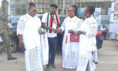 A section of the public in all white to signify their happiness