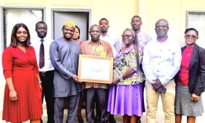 Mrs Quaittoo (third from right) and Alhaji Abdul- Rahaman (third from left) holding the certificate . With them are other Management Staff of NTC and GSA staff Photo; Stephanie Birikorang