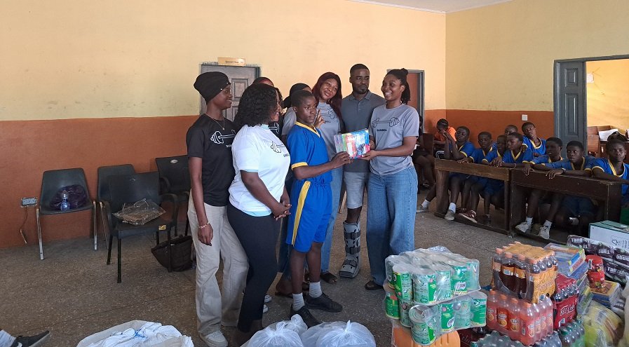 • One of the students receiving books from the donors