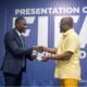 Ref Serlom Yao Bless (left) receiving his badge from FA President, Kurt Okraku