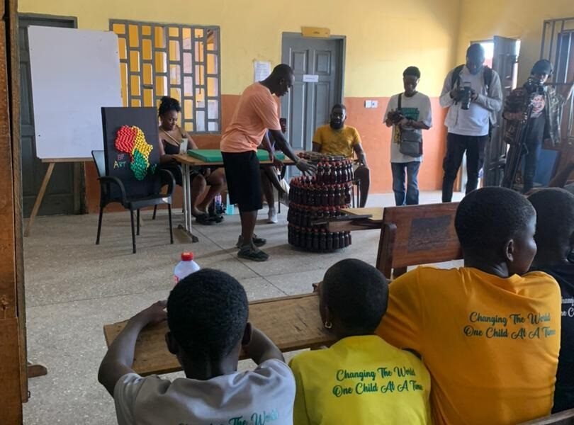 Some of the children observing the Dilemma of A Ghost closely works with plastic material