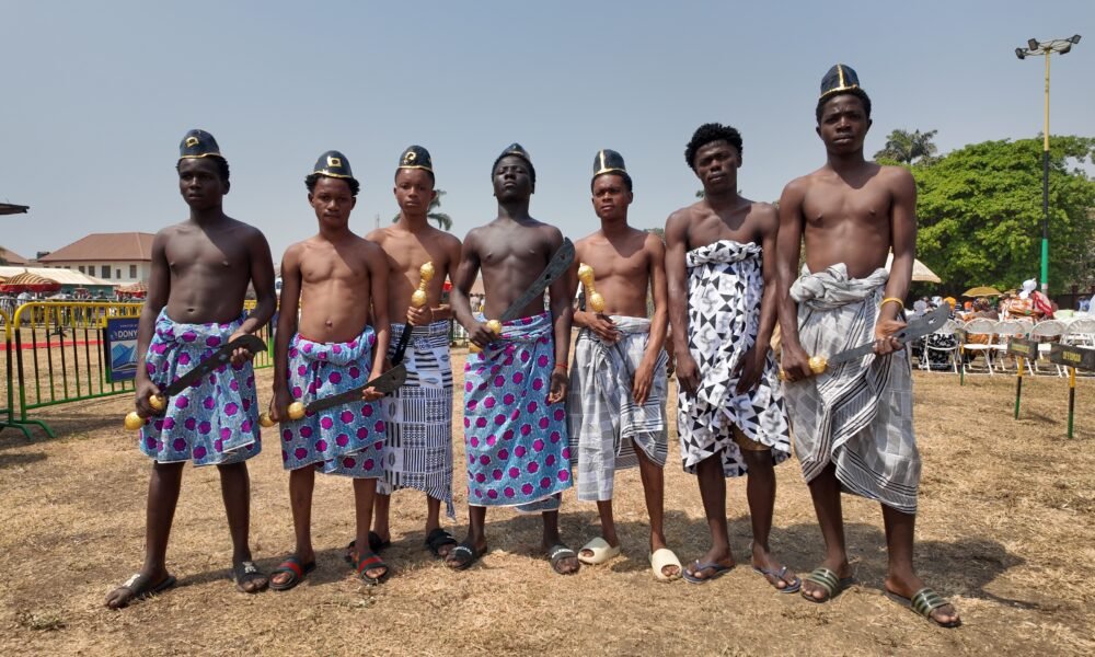 Some royal umbrella and sword bearers who lead the processions