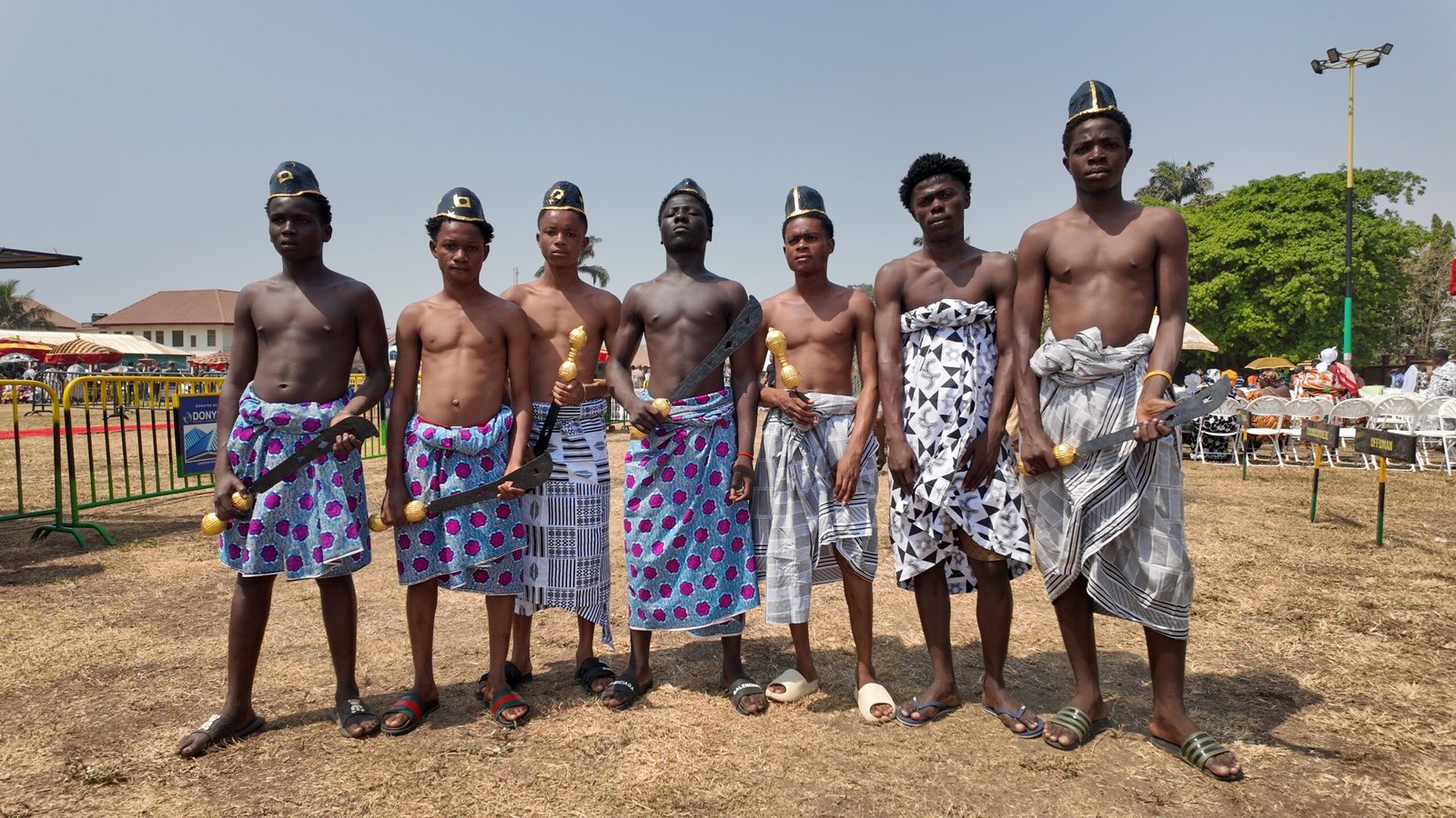 Some royal umbrella and sword bearers who lead the processions