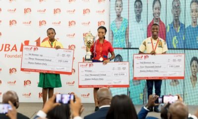 • Top three winners displaying their awards