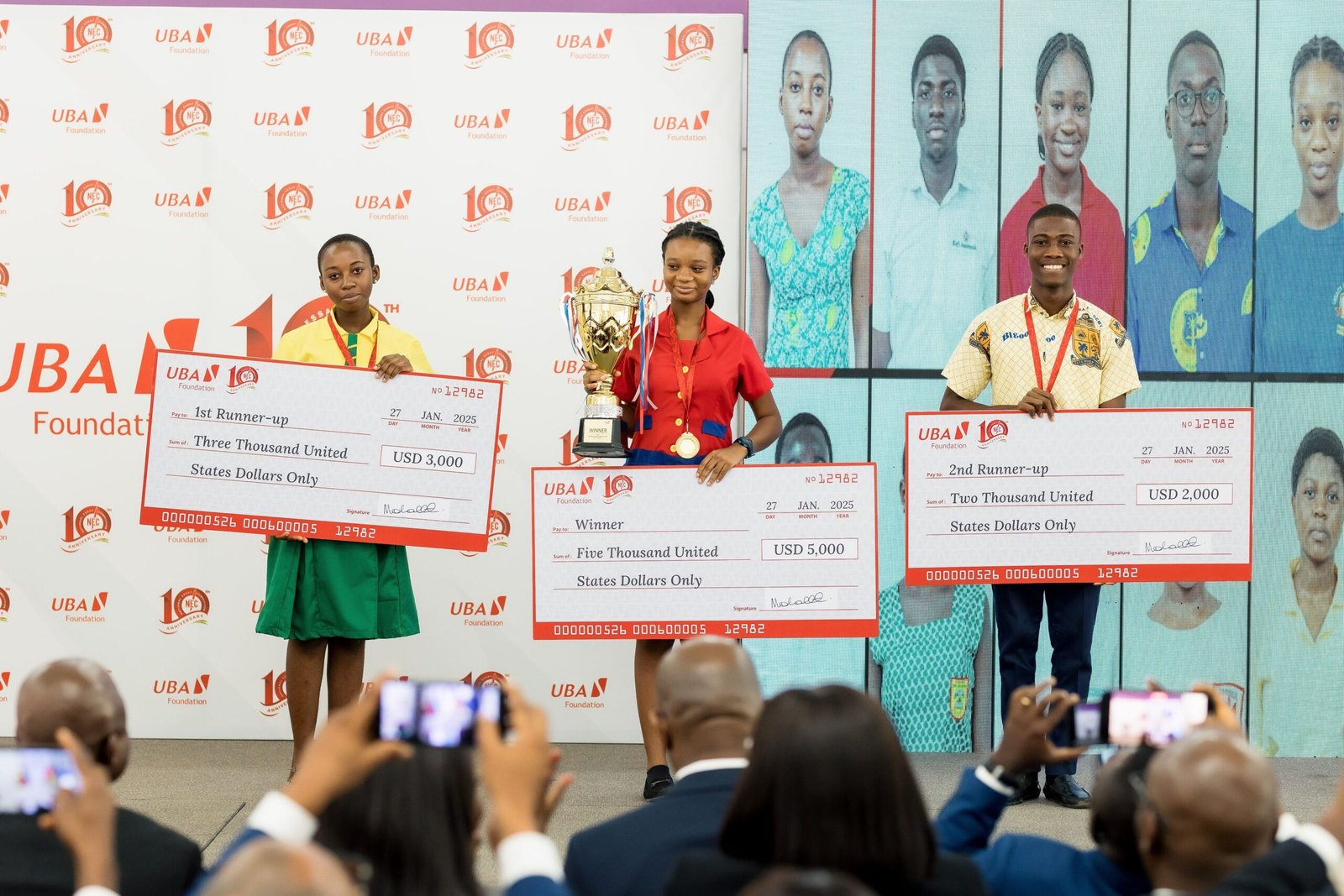 • Top three winners displaying their awards