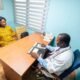 A doctor and a patient in a consulting room