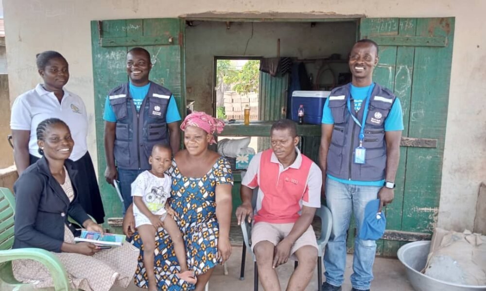 A group picture of the team and the family after successful vaccination