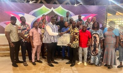 • Mr. Peter Kofi Marfo, in smock & white presenting to Mr. Isaac Fynn, the Dean of the District Cultural Officers receiving