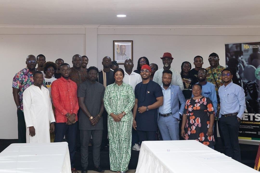 • Kafui Danku (middle) flanked by stakeholders