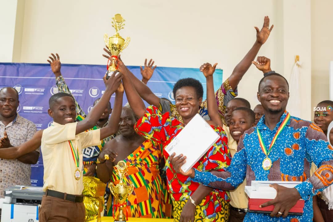 The Winner display a trophy